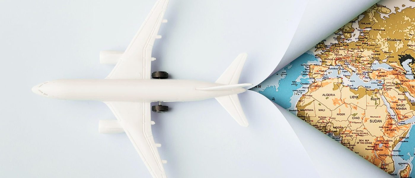 top-view-white-toy-plane-and-map